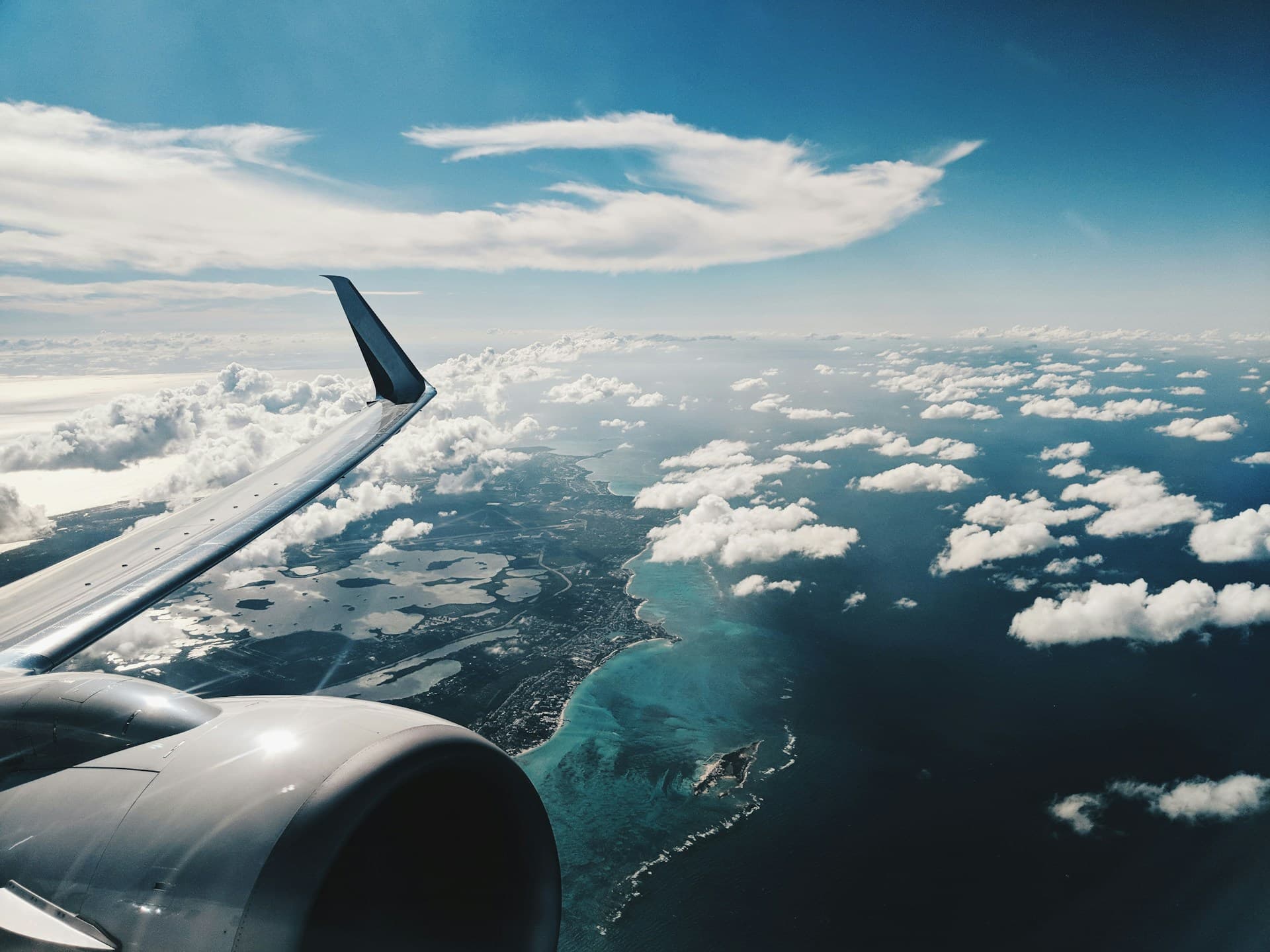 View from an airplane over a tropical coastline